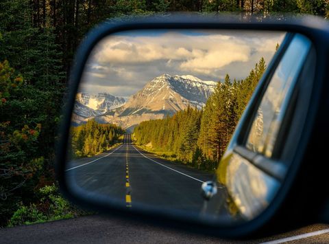 Wing mirror view of the Icefields Parkway