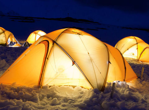 antarctic camping on ice tents lit up at night oc