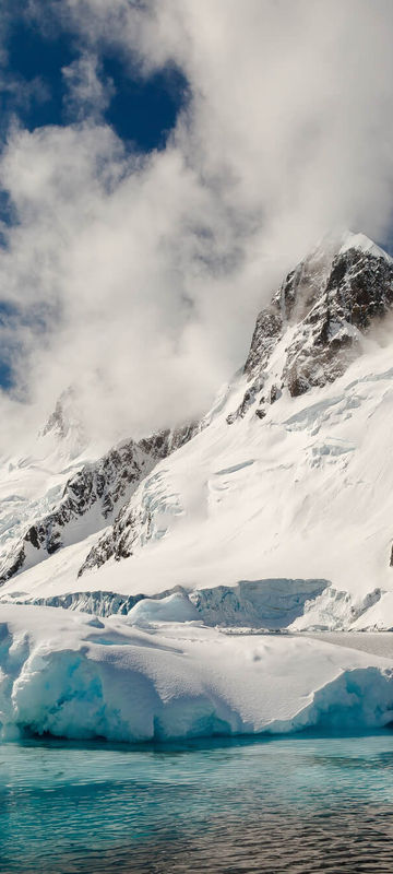 antarctica sculpted blue ice and mountains qe