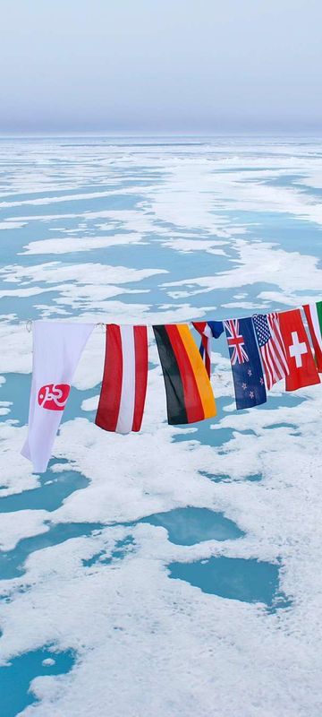 arctic multi nation flags at north pole qe