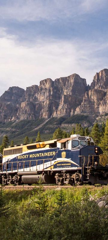 canada rocky mountaineer passing castle mountain rm