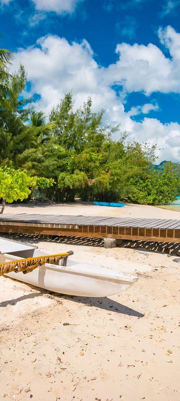 cook islands outrigger canoe on beach astk