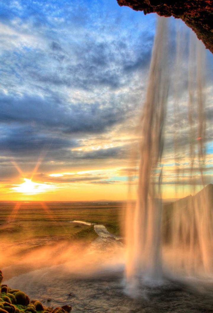 iceland seljalandsfoss summer sunset cloudy sky istk