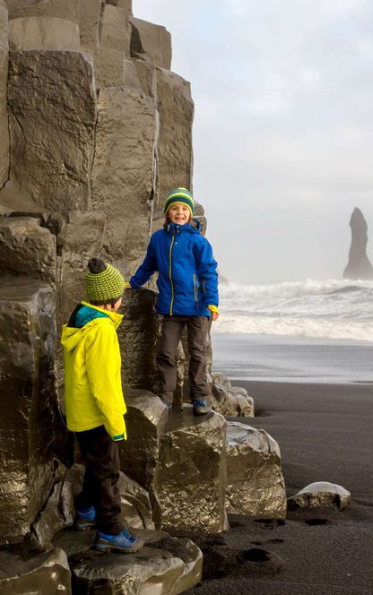 iceland south west children on basalt cliff reynisdrangar istk