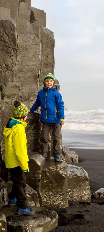 iceland south west children on basalt cliff reynisdrangar istk