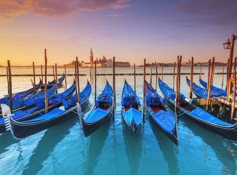 italy venetian lagoon with docked gondolas istk