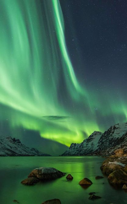 northern norway northern lights over fjord tromso doll