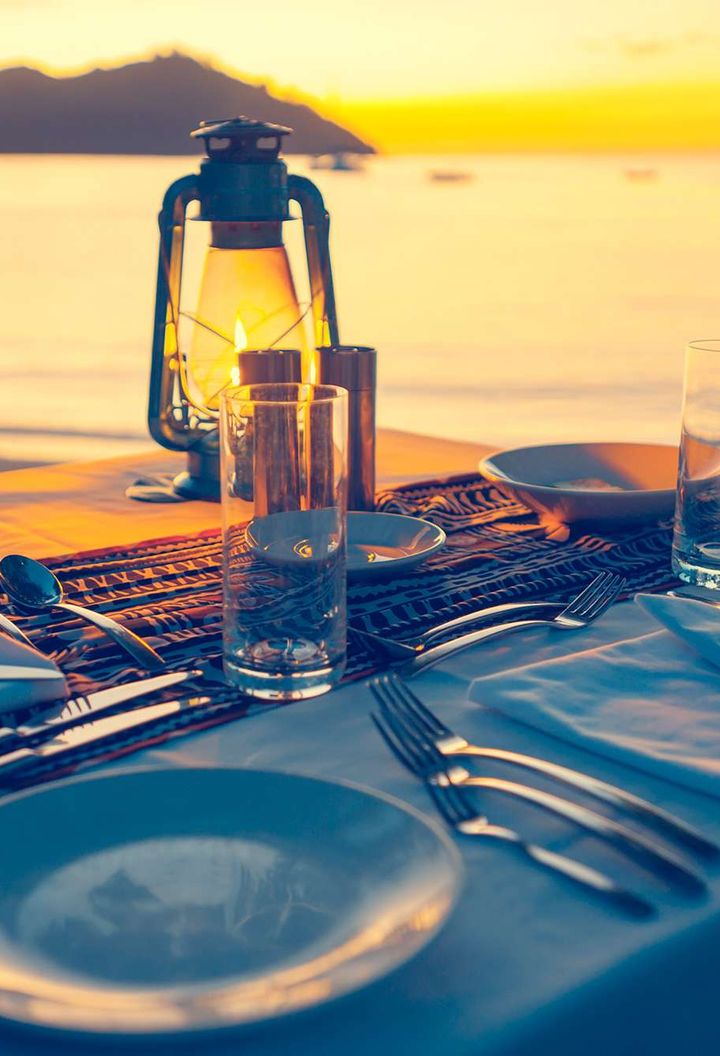 pacific-islands-beachside-dining-at-sunset-istk