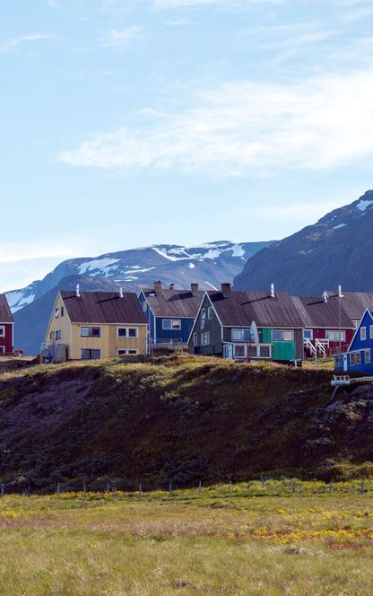 south greenland coloured houses on hill in narsaq istk