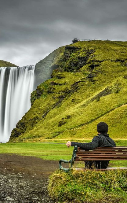 south iceland taking in the view at skogafoss istk