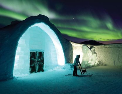 northern lights over the icehotel in Swedish Lapland