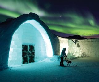 northern lights over the icehotel in Swedish Lapland