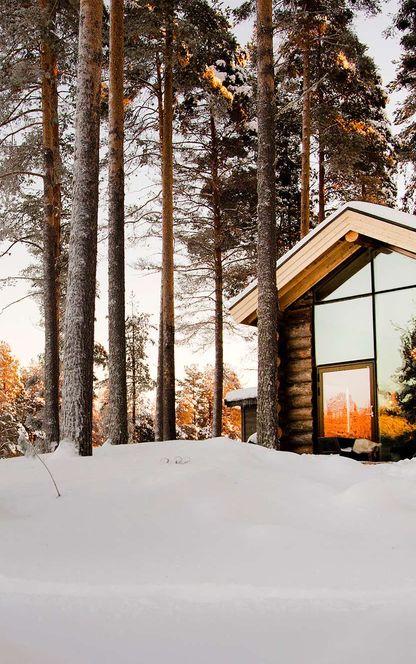 swedish lapland arctic retreat cabin at sunset